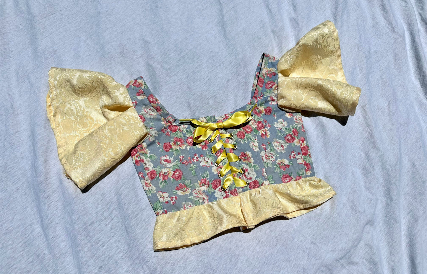 Blue and pink floral corset with yellow sleeves